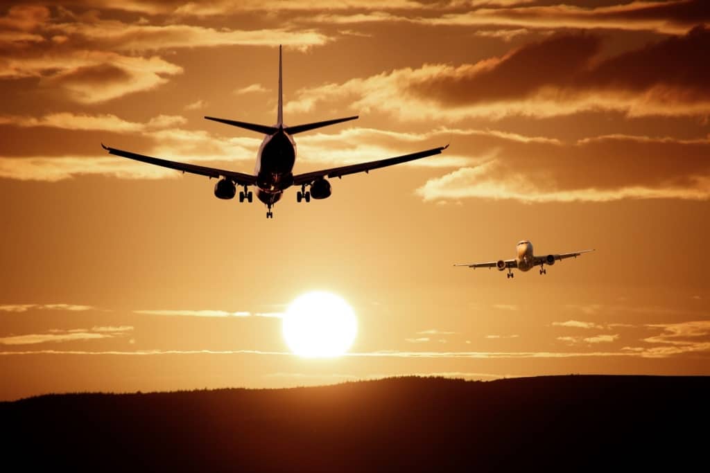 Airplane taking off into the sunset