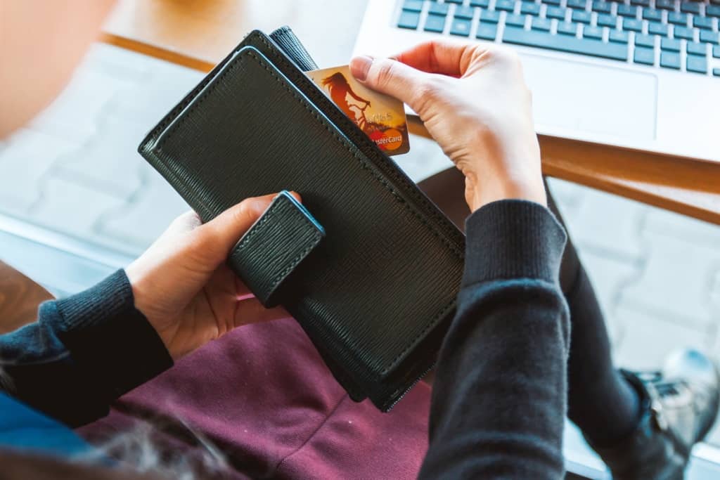 Looking at credit cards in her wallet