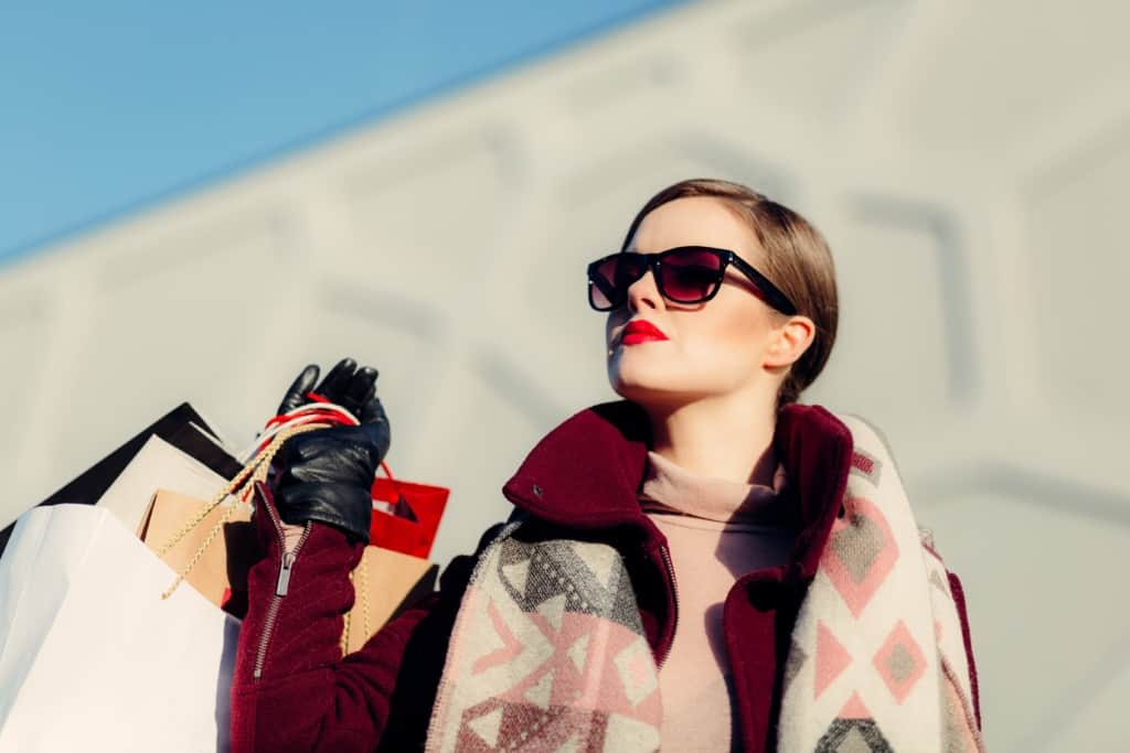 Woman with sunglasses and shopping bags